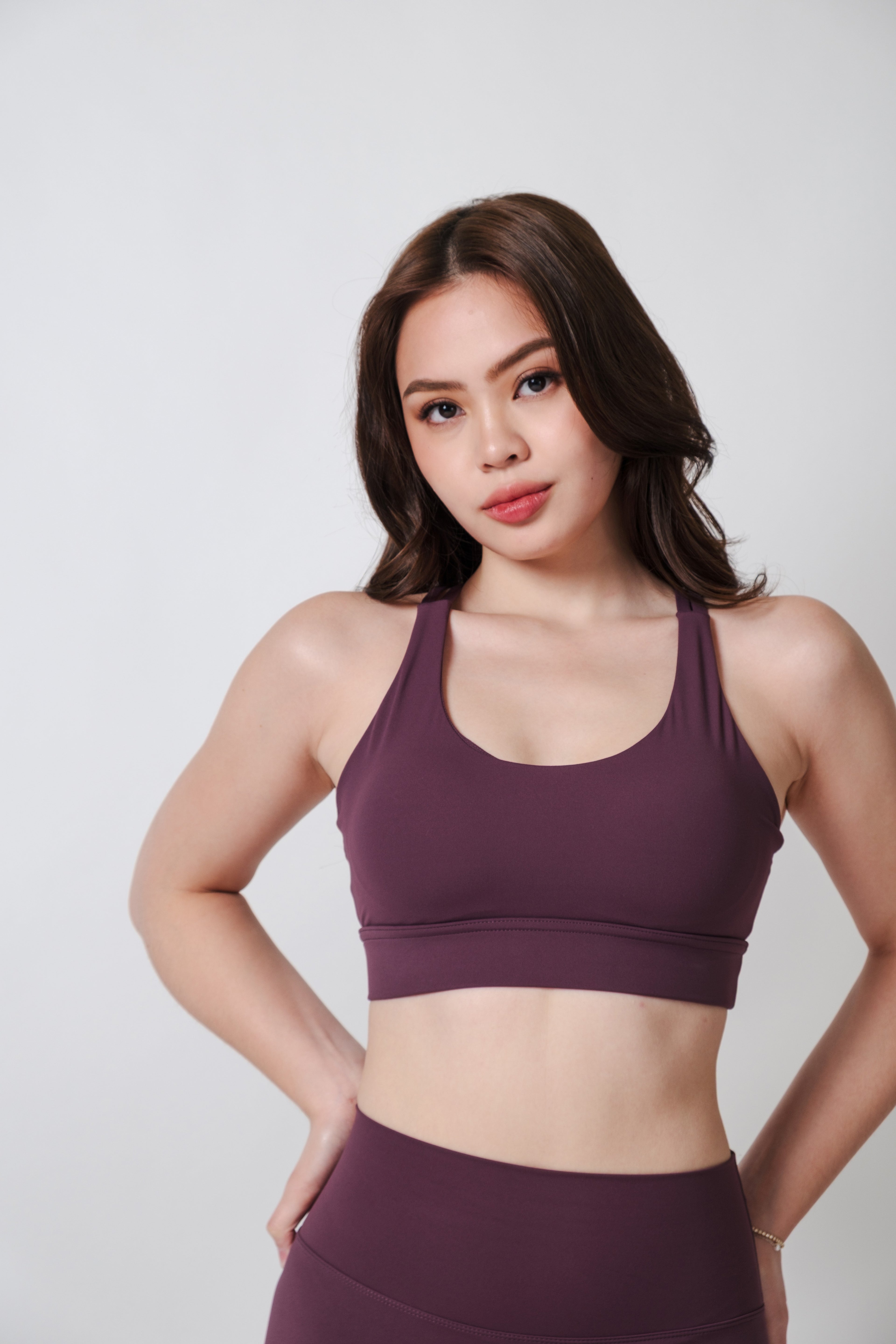 Flow State Criss Cross Sport Bra Series Plum Alex is 5'3 wearing S