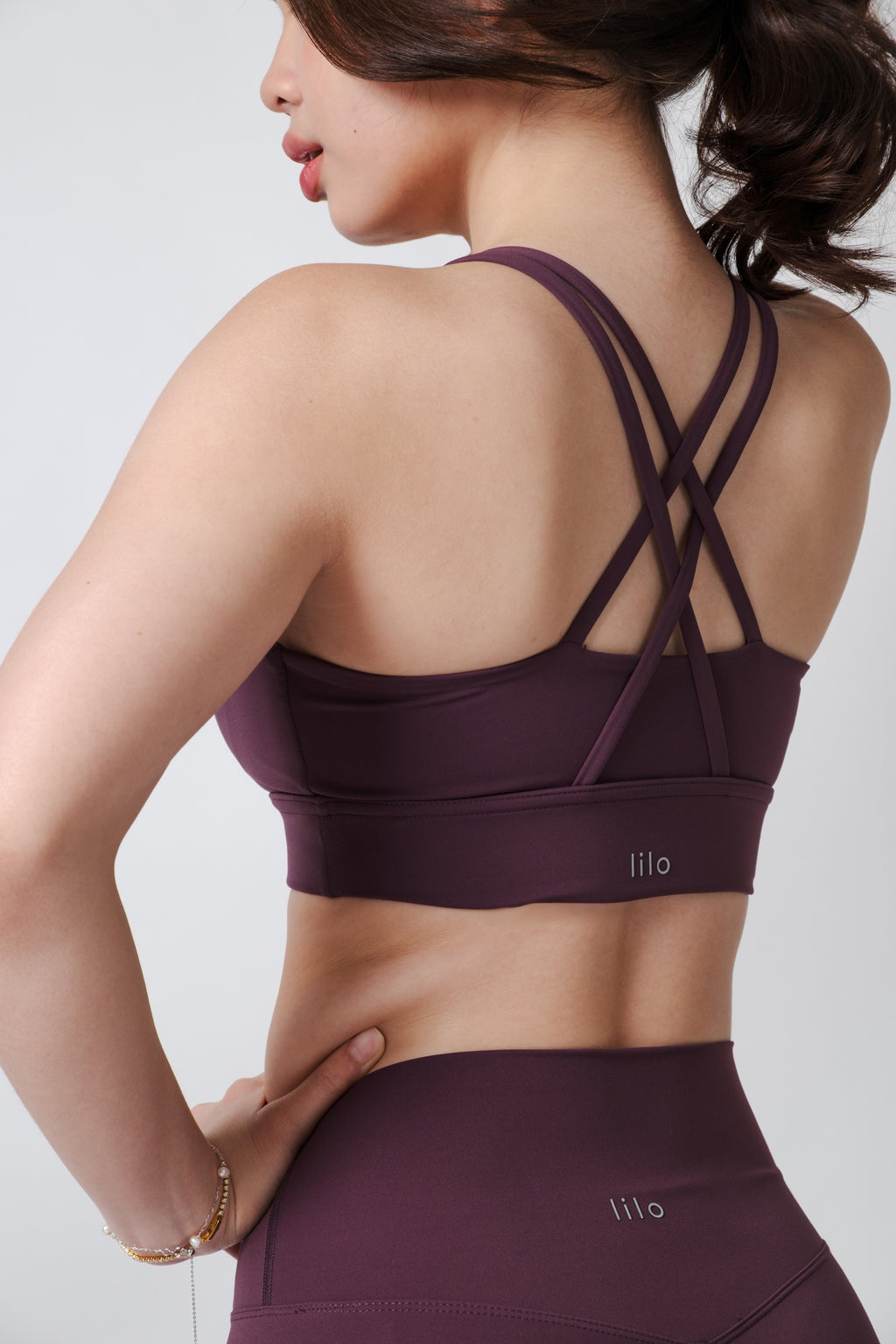 Flow State Criss Cross Sport Bra Series Plum Alex is 5'3 wearing S