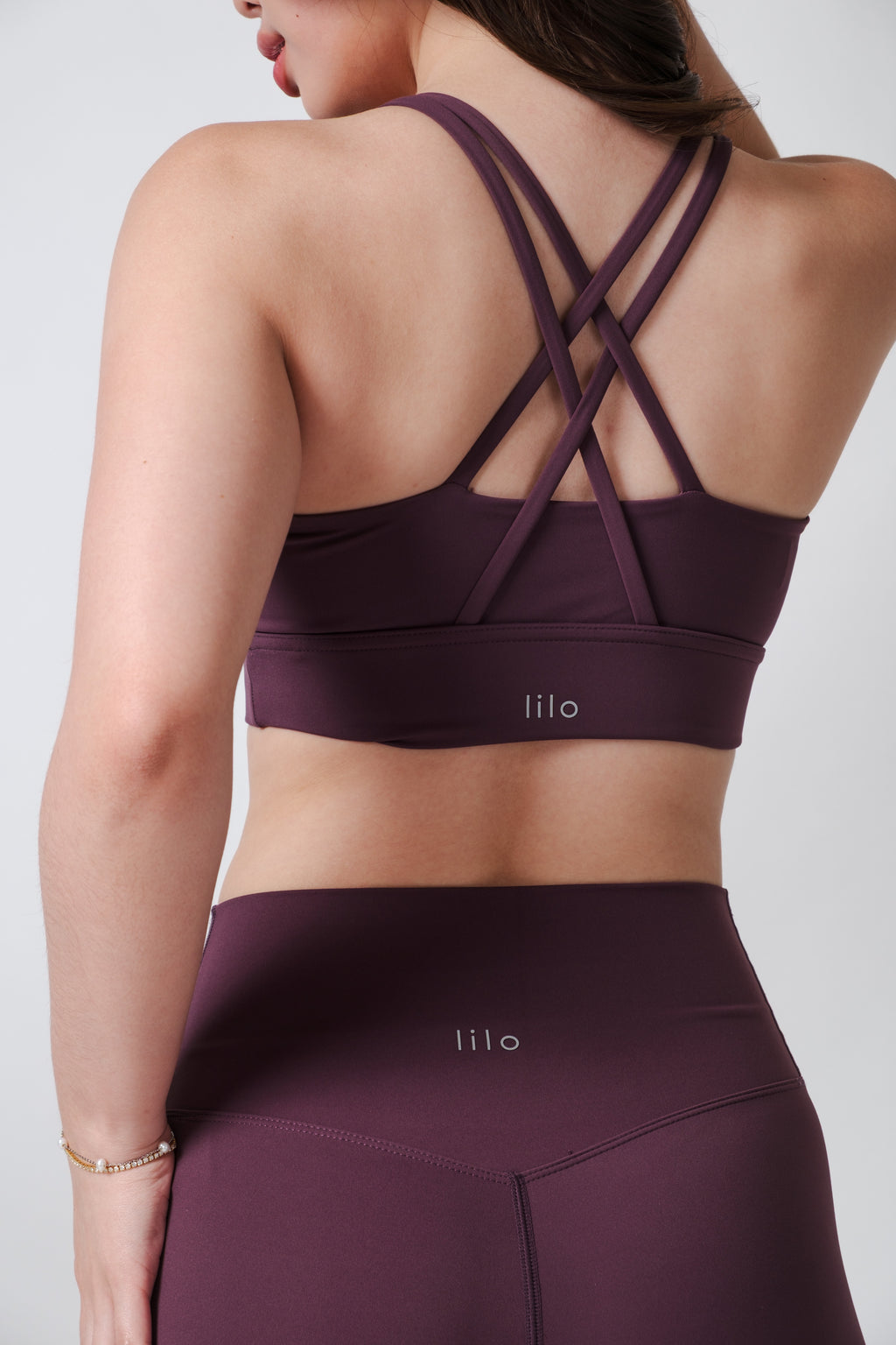 Flow State Criss Cross Sport Bra Series Plum Alex is 5'3 wearing S